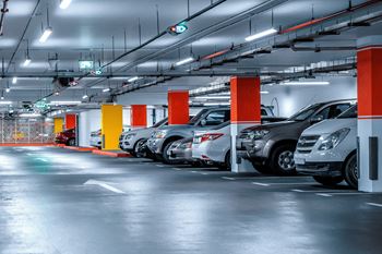 a row of cars parked in a parking garage